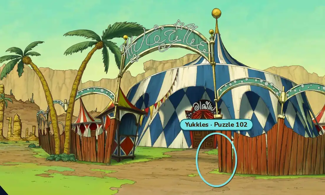 The One-Ring Circus entrance by day: palm trees, a ticket booth and a blue-and-white big top behind a wooden fence, with a teal ring on the path beside the fence to the right of the entrance and a gold label reading Yukkles, Puzzle 102